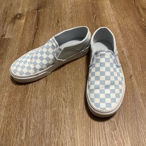 White and blue checkered vans.